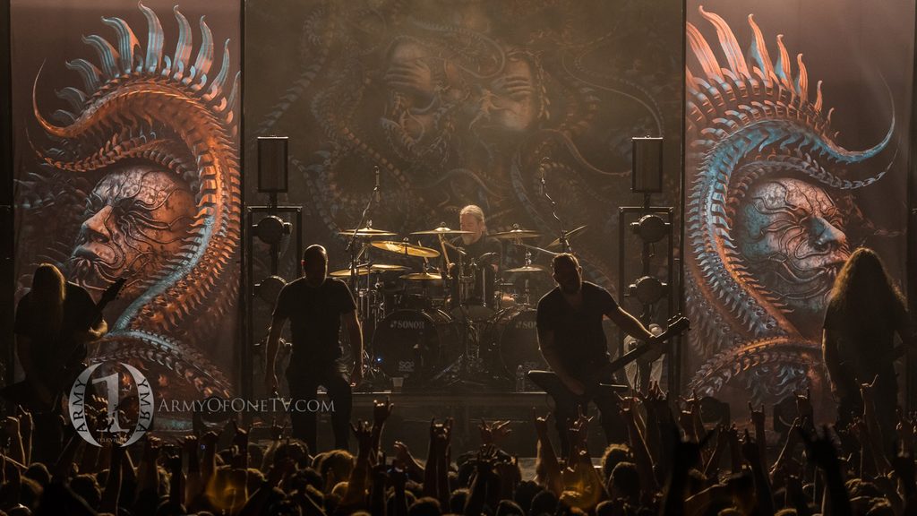 Drummer performing on stage at a live concert