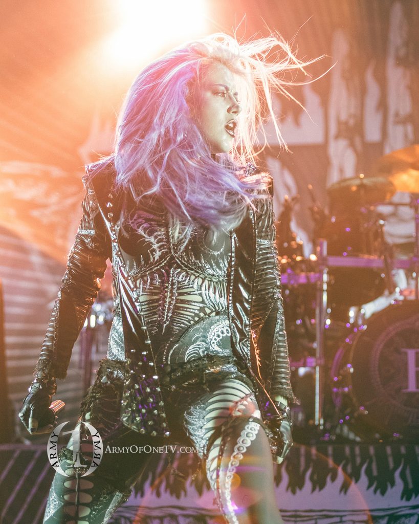 Female vocalist performing under concert lights