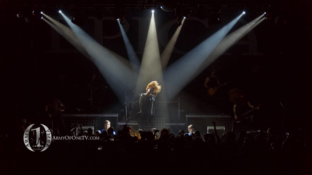 Rock vocalist performing under dramatic stage lighting