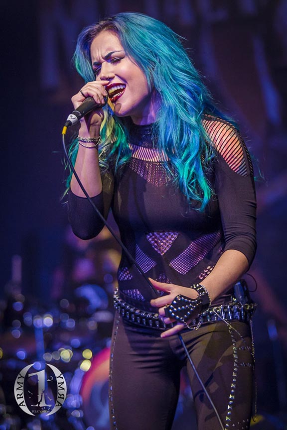 Female rock singer performing live in concert